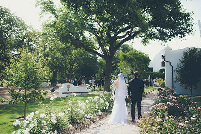 Wedding couple walking towards their guests