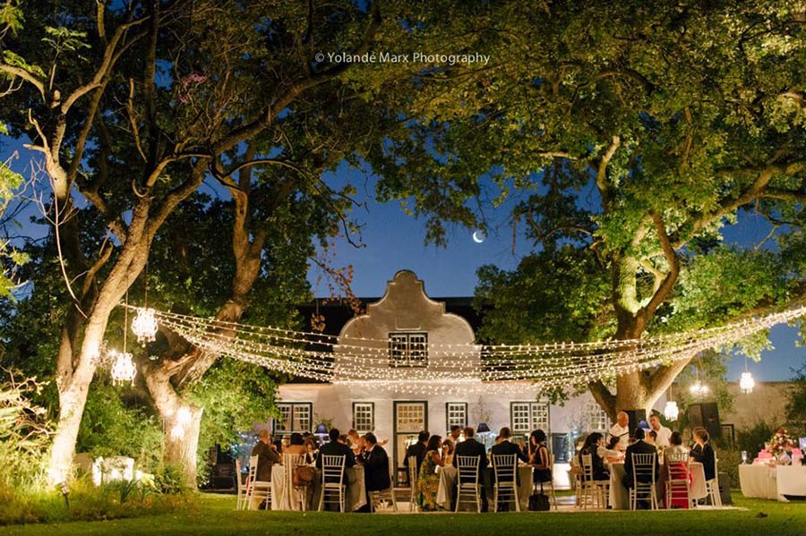 Wedding reception under fairy lights at Hawksmoor House