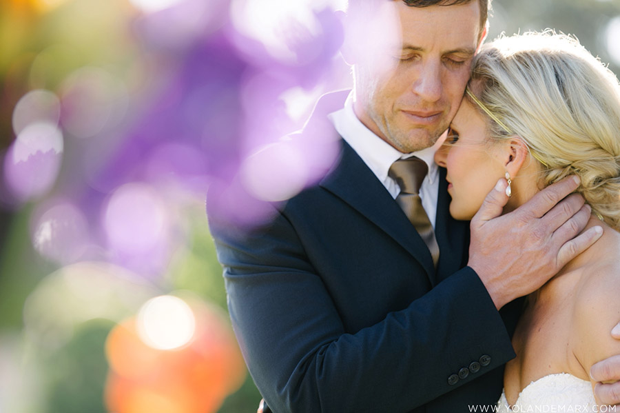 Bride and groom embracing one another