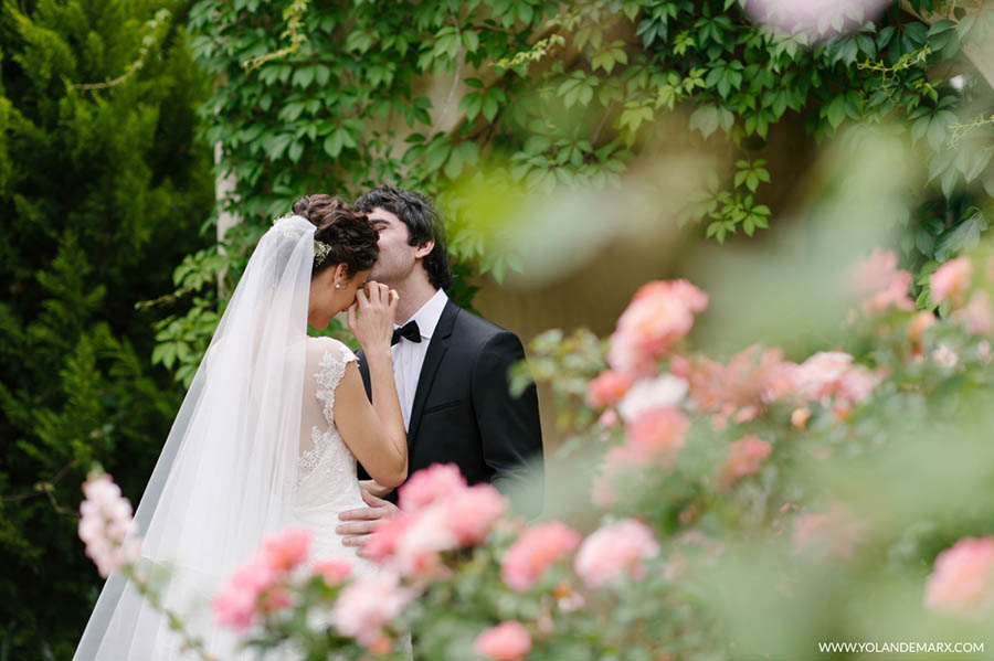 Bride and groom share an intimate moment. Photo by Yolande Marx