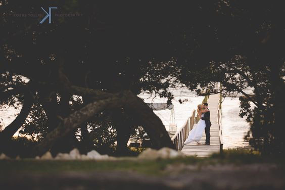 Wedding Couple Shot through the trees at Mosaic Wedding Venue, Kobus Tollig Photographer