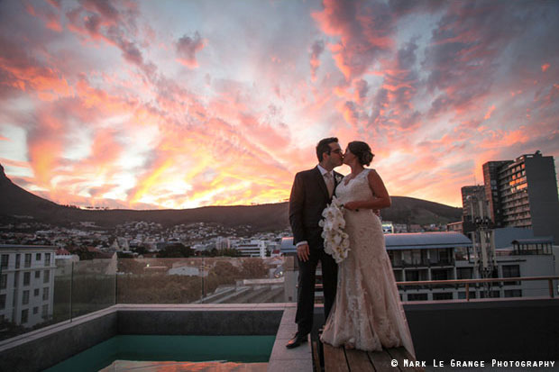 Bride and Groom Kiss on Rooftop Mark Le Grange Photography Cape Town Wedding Venue East City Studios