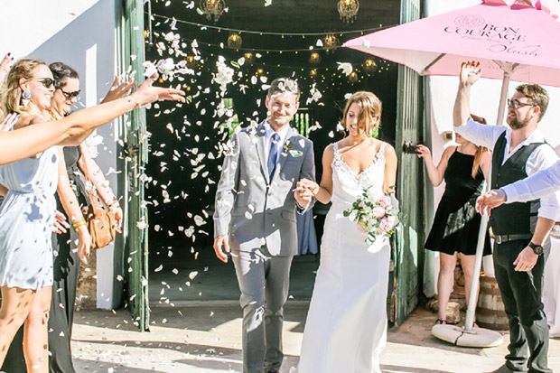 Bride and Groom showered with Confetti at Cabrieres Wedding Venue by Claire Nicola Photography