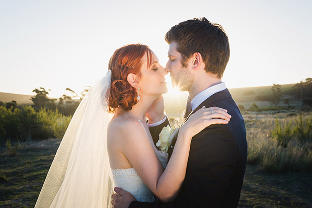 Bride and Groom Share a Kiss in the Setting Sun at Cape Town Wedding Venue