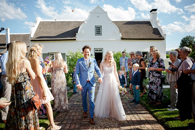 Bride and Groom Showered in Confetti at the Oaks Wedding Venue