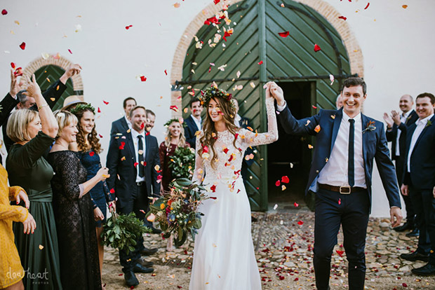 Bride and Groom are showered with confetti