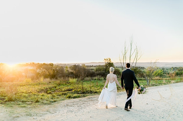 Bride and Groom walk off into the sunset Hertford Country Hotel Wedding Venue Gauteng