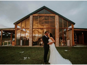 Couple Photograph in front of Glasshouse Wedding Venue