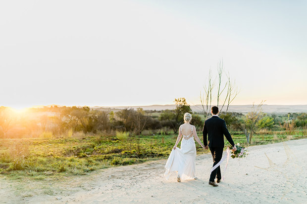 Bride and Groom walk off into the sunset