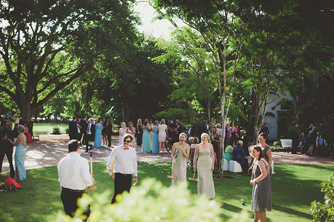 Wedding guests playing croquet