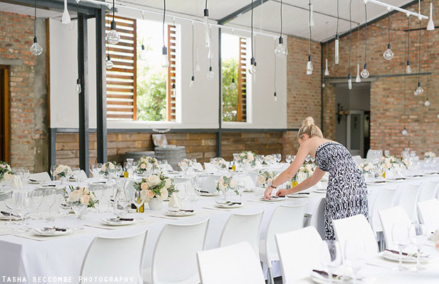 Authentic Planning Setting Up Reception Tables at Rockhaven Rustic Wedding Venue