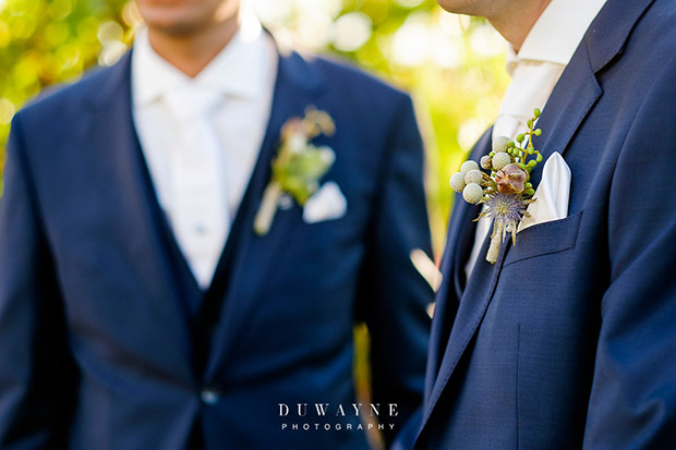 Grooms in navy suits