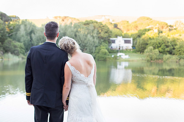 Bride and Groom Share a moment overlooking the water at Zevenwacht Cape Town Wedding Venue